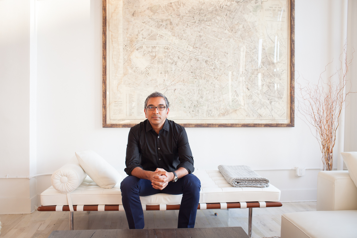 Corporate Portraits CEO Headshots NYC Modern Portraits Photography NYC Portrait of architect, urbanist, author, and Columbia University associate professor Vishaan Chakrabarti at his home in Manhattan. Map of Paris hanging on wall behind. New York, NY