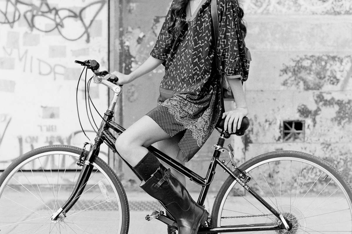 NYC street fashion photography in black and white with model Alexandra Chelaru on bike for French fashion brand Nu New York Union Square