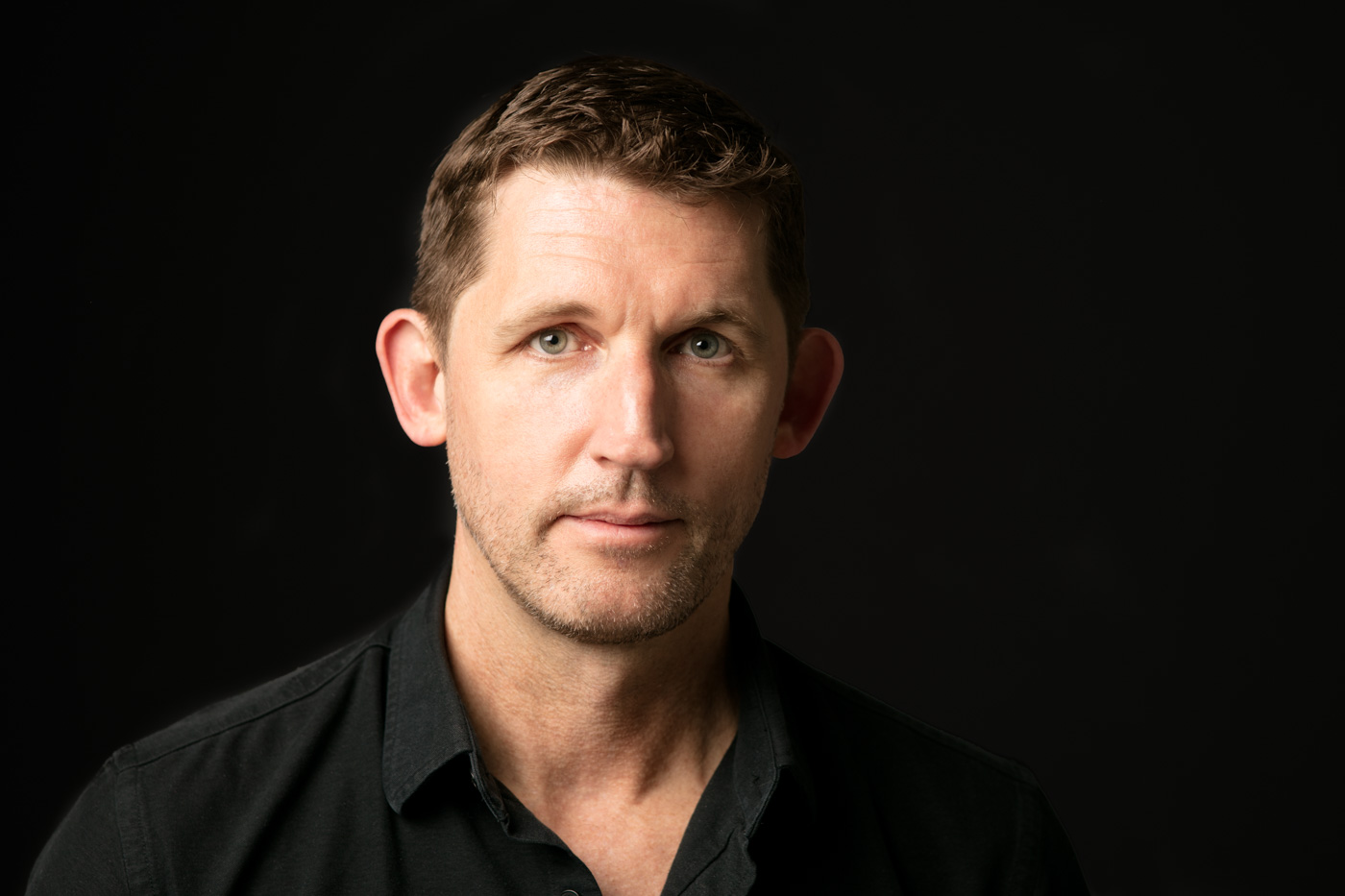 Dramatic headshots of a marketing technology executive at Art Not War