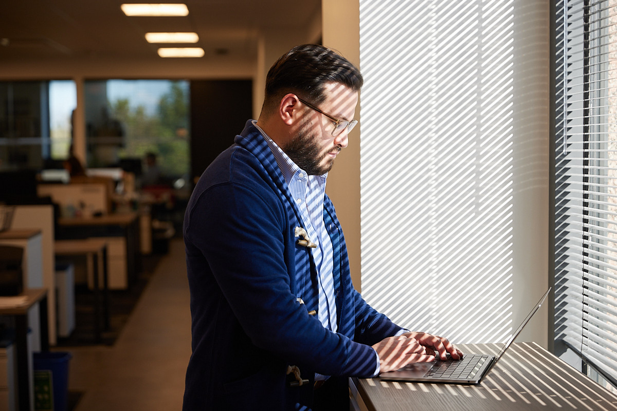 Dallas Office Photographer \ Corporate Lifestyle Photography of Man Working on Laptop