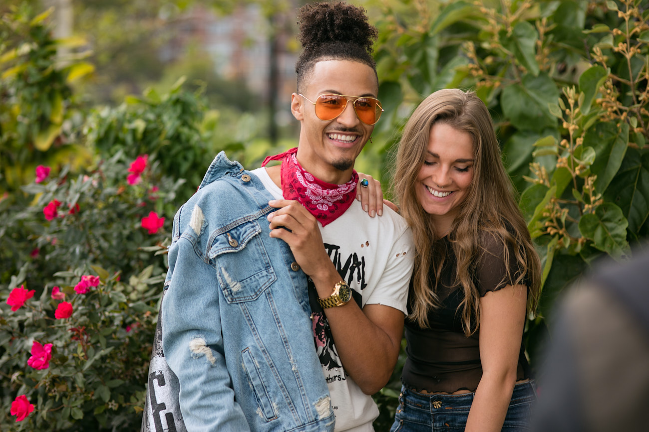 The Impact of Lifestyle Photography in Social Media Marketing - Interracial Couple Luahing OUtdoors in Park