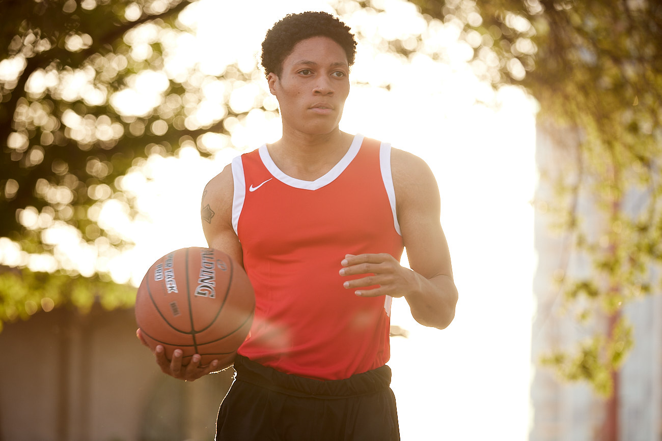 The Impact of Lifestyle Photography in Social Media Marketing - Young Man in Nike Jersey Playing Basketball