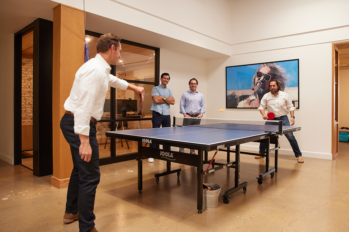 The Power of Authenticity in Corporate Lifestyle Photography - Men at Boutique Financial Firm Play Tennis