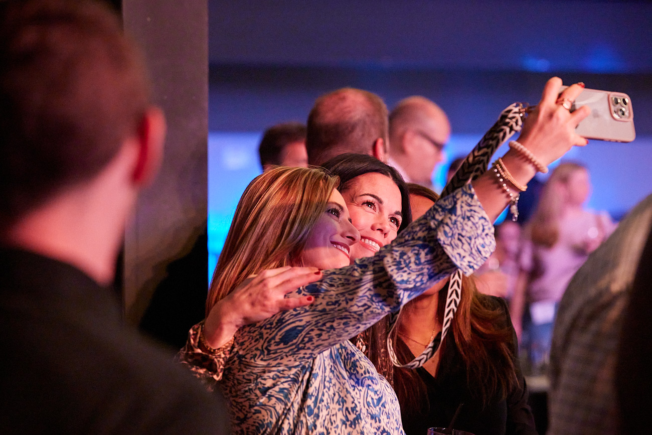 Event Photographer Dallas - Women Taking Selfies at Corporate Event